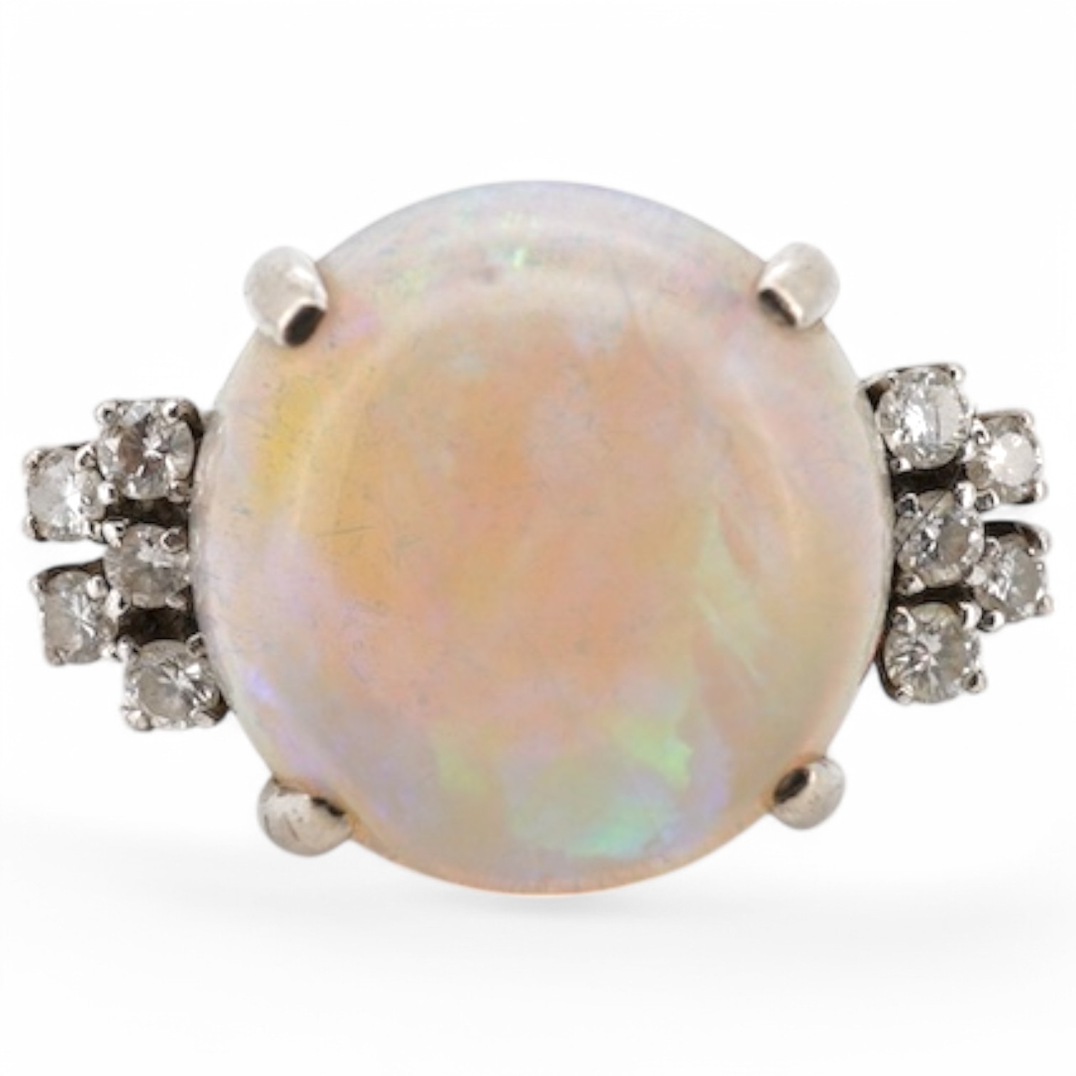 A 9k white metal and single stone cabochon white opal set dress ring, with ten stone diamond set shoulders, size P, gross weight 6.5 grams. Condition - poor